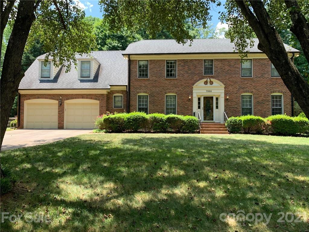 7900 Quail Hill Road Charlotte, NC 28210 - Photo 2 of 28 a front view of a house with a garden