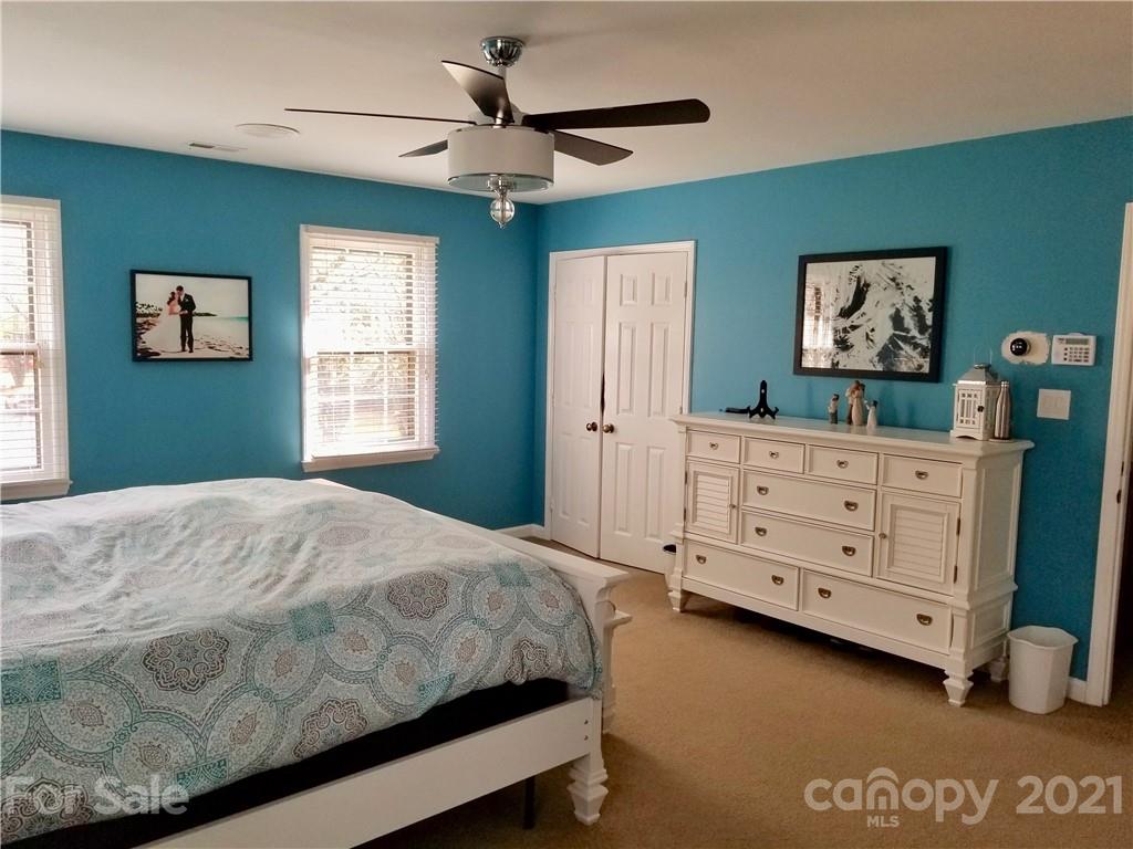 7900 Quail Hill Road Charlotte, NC 28210 - Photo 12 of 28 a bedroom with a bed dresser and a window