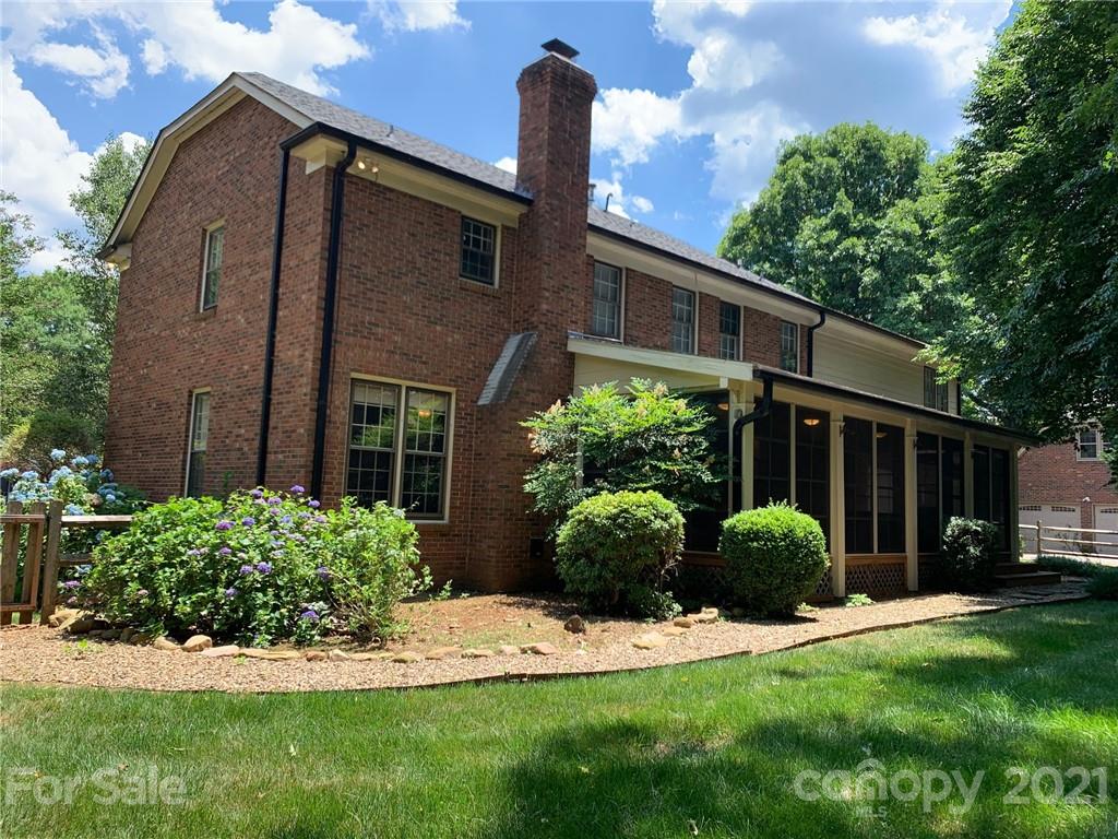 7900 Quail Hill Road Charlotte, NC 28210 - Photo 25 of 28 a front view of a house with garden