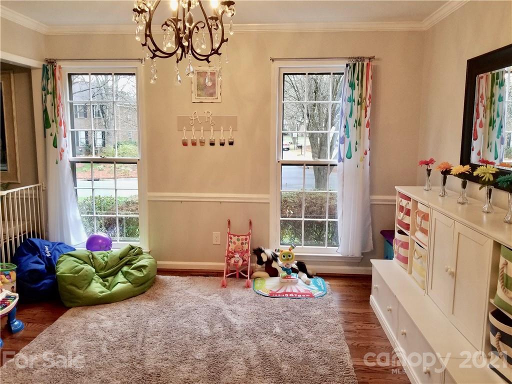 7900 Quail Hill Road Charlotte, NC 28210 - Photo 6 of 28 a bedroom with furniture and a large window