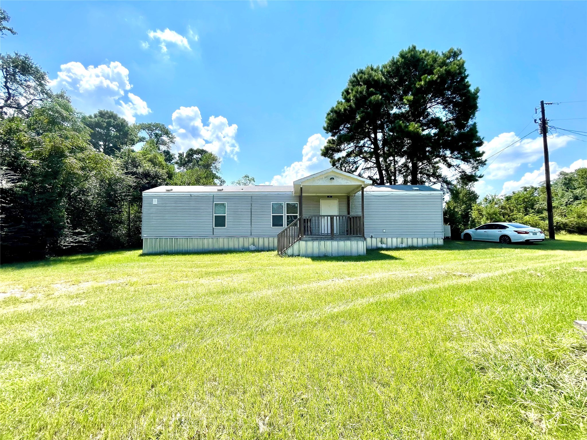 a view of a house with a yard and garage