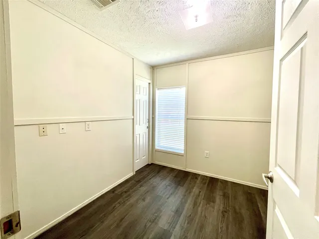 a view of a small space with wooden floor