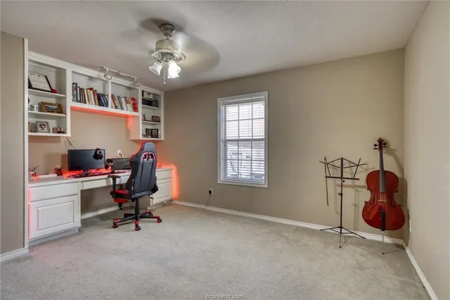 a bedroom with a bed and a view of living room
