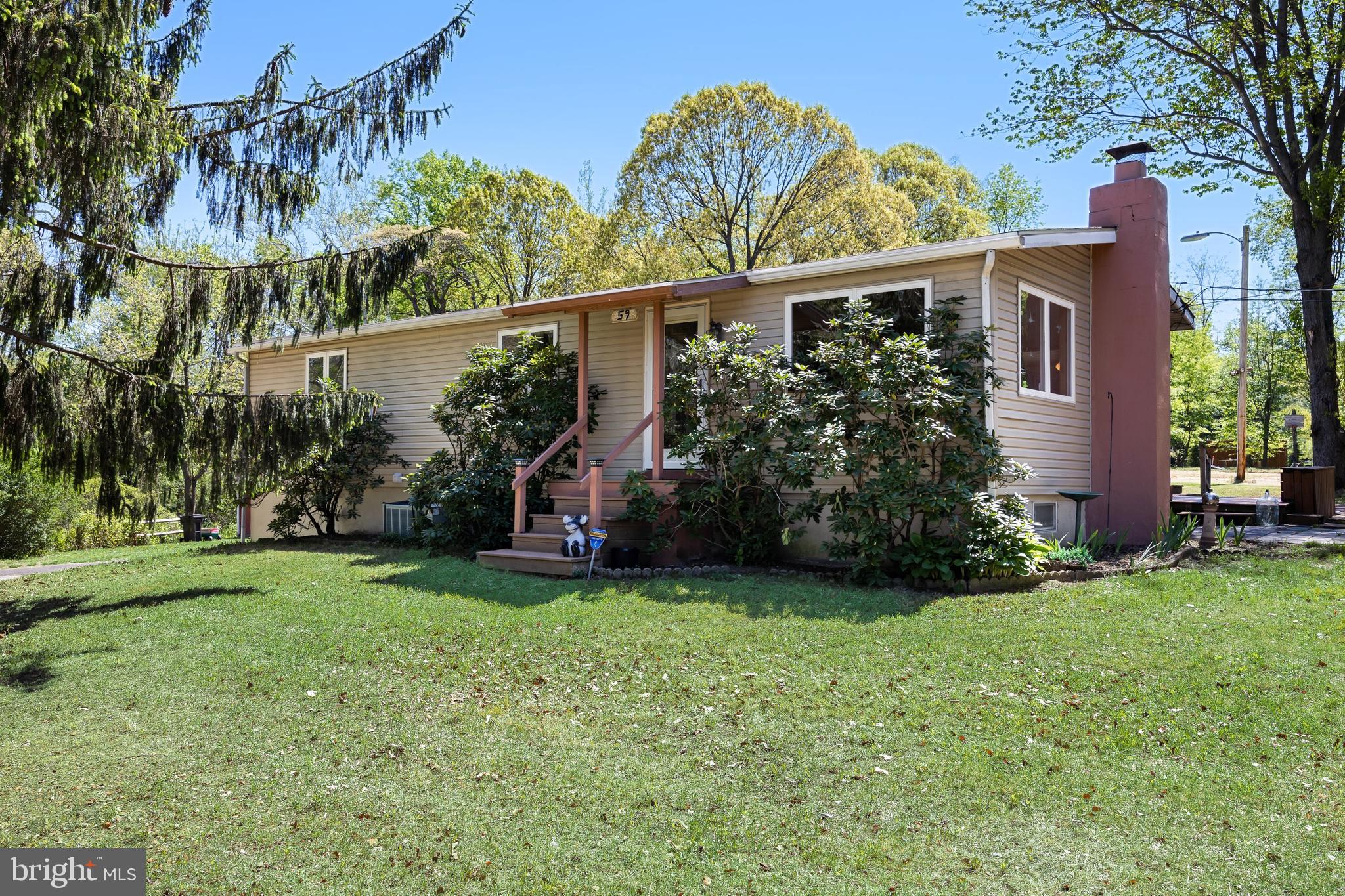 59 Berkley Road Clarksboro, NJ 08061 - Photo 3 of 49 a view of a house with a yard and potted plants