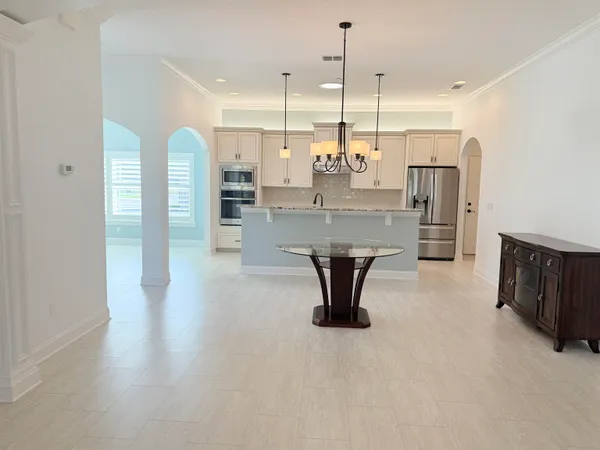 a dining hall with stainless steel appliances