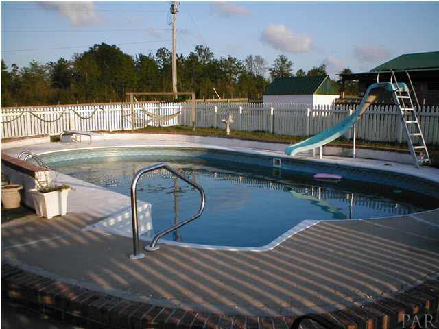 6959 Martin Road Milton, FL 32570 - Photo 10 of 11 a view of a swimming pool with a patio
