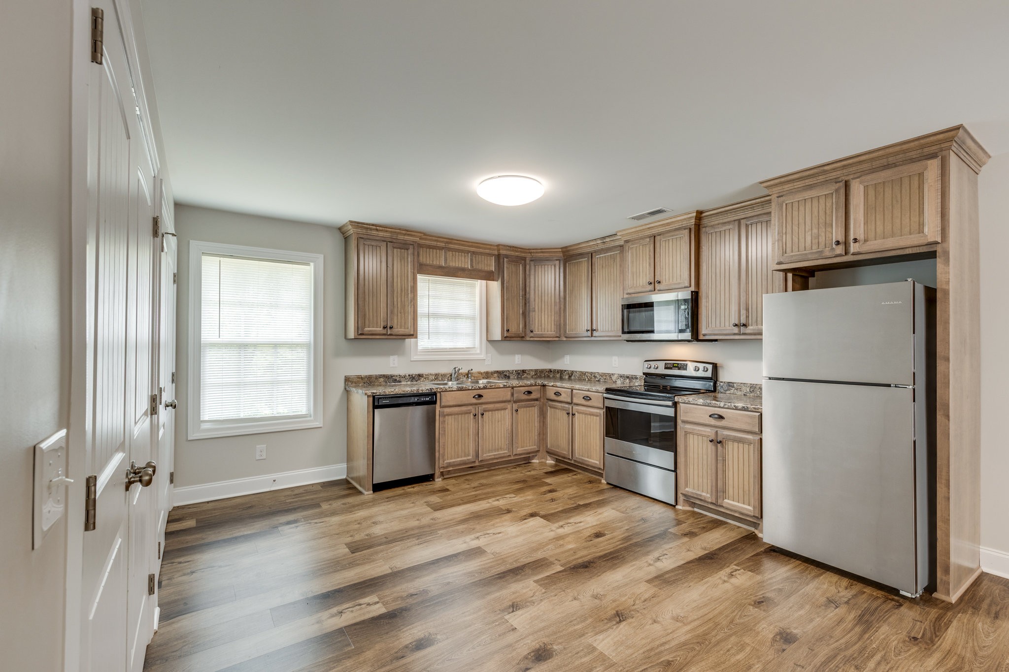 143 Ragsdale Lane Pulaski, TN 38478 - Photo 11 of 22 a kitchen with stainless steel appliances granite countertop a refrigerator stove and sink