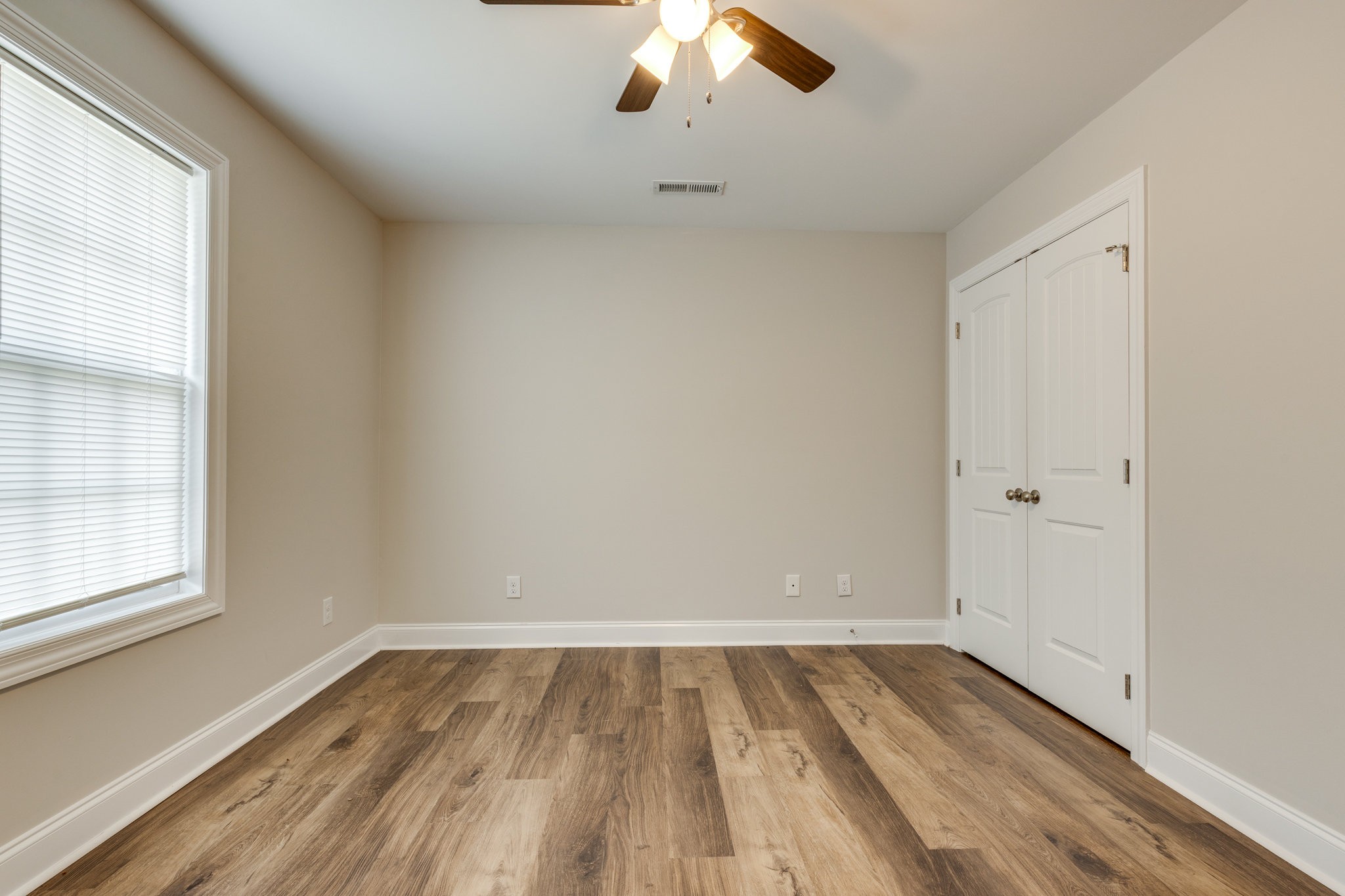143 Ragsdale Lane Pulaski, TN 38478 - Photo 15 of 22 wooden floor in an empty room with a window