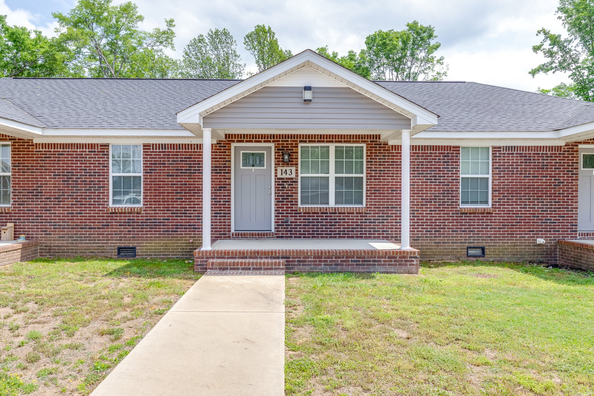 143 Ragsdale Lane Pulaski, TN 38478 - Photo 3 of 22 a front view of a house with a yard and garage