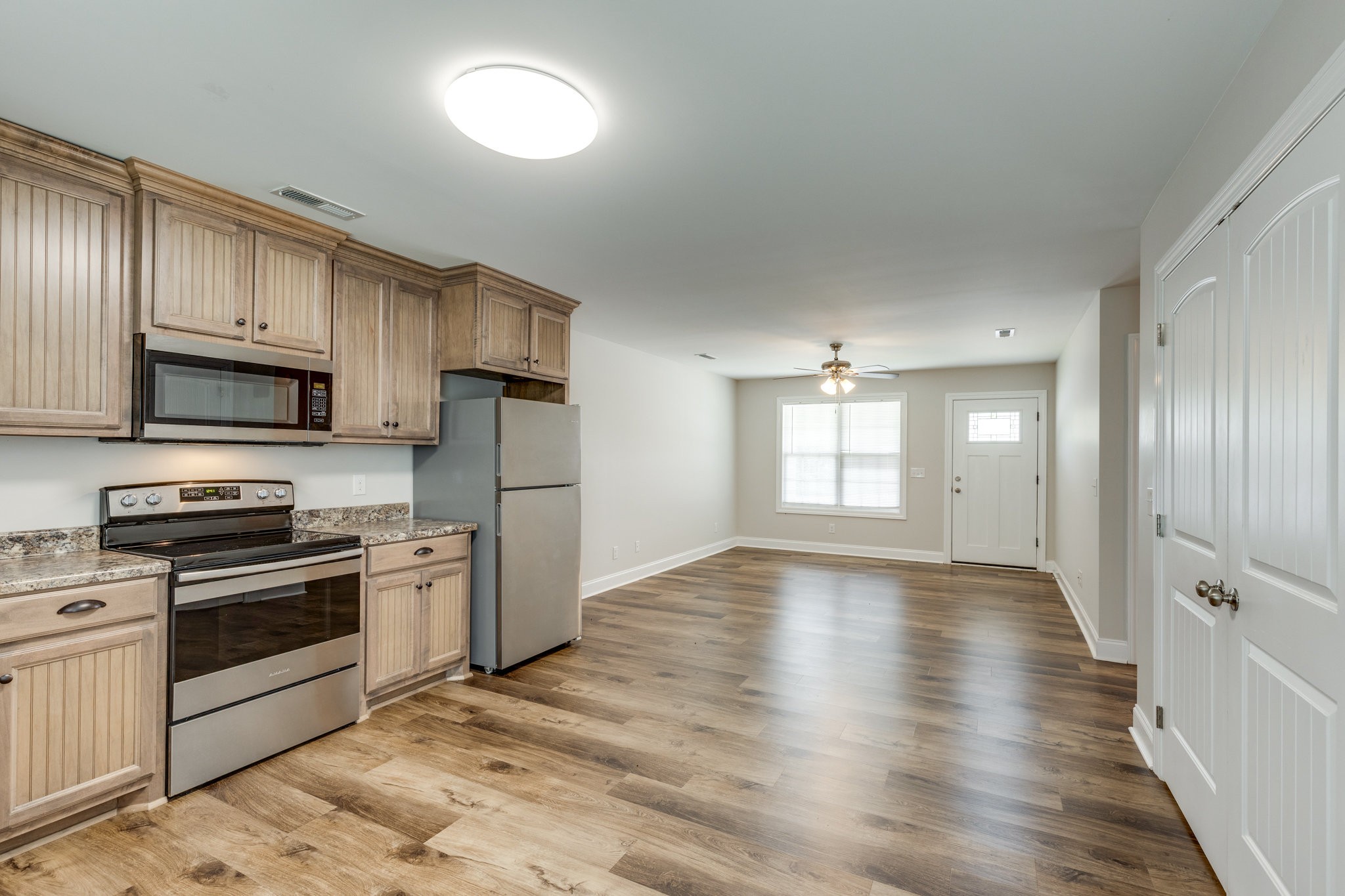 143 Ragsdale Lane Pulaski, TN 38478 - Photo 10 of 22 a kitchen with stainless steel appliances granite countertop a stove a sink and a refrigerator