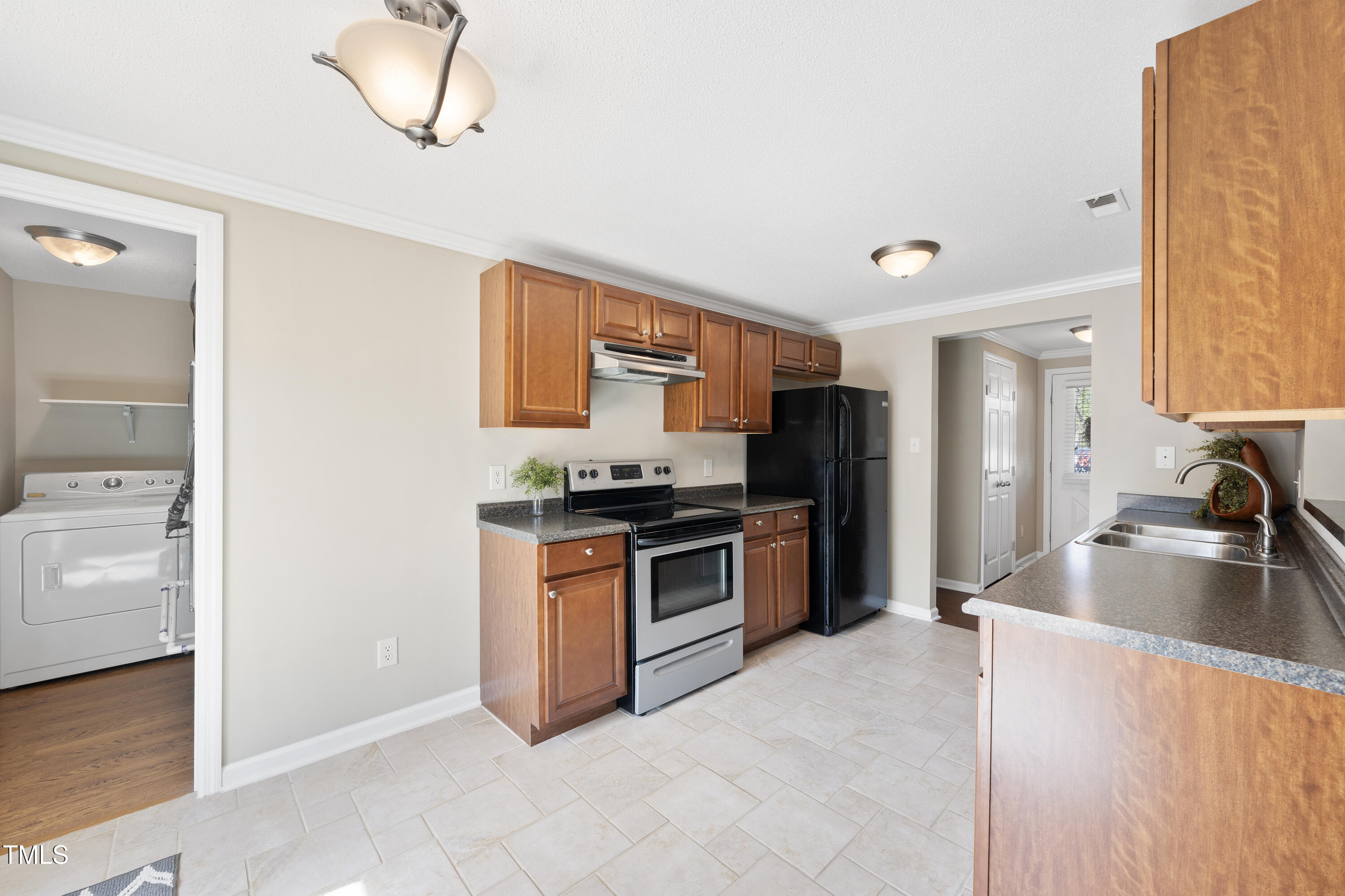 103 Willoughby Lane Cary, NC 27513 - Photo 7 of 21 Kitchen and laundry