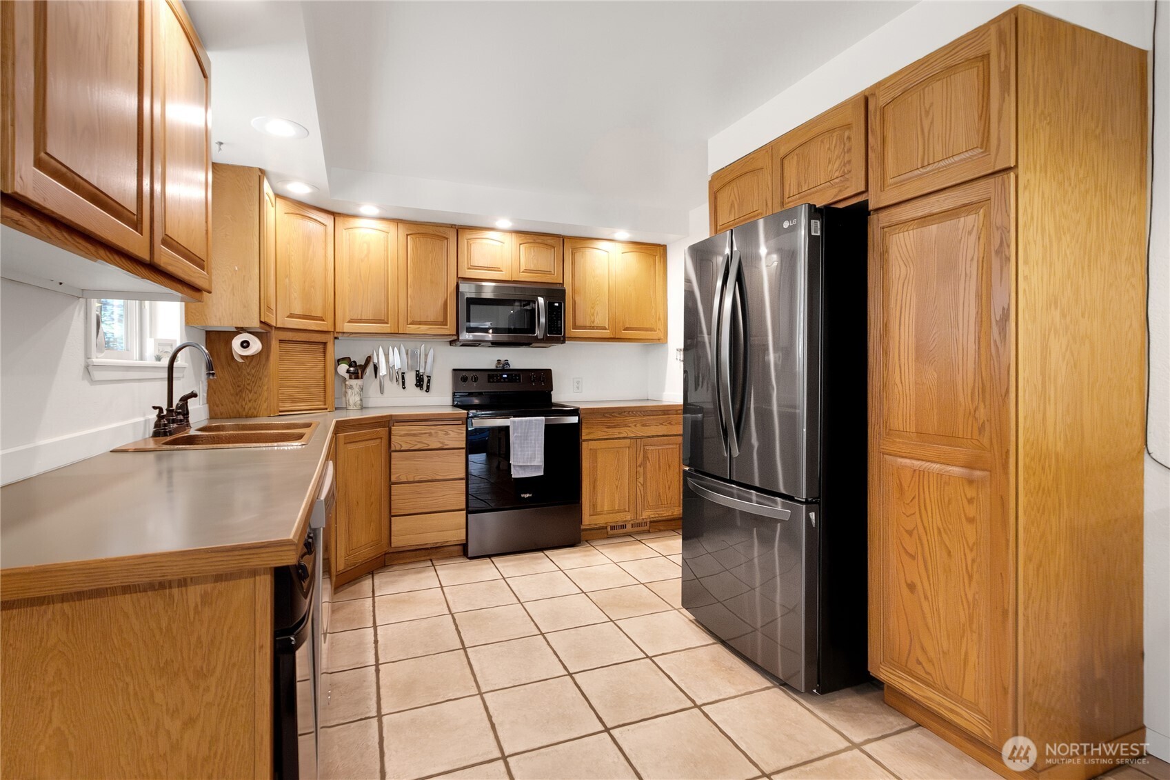 102-40 Crumb Road Morton, WA 98356 - Photo 13 of 40 a kitchen with stainless steel appliances granite countertop a refrigerator and a sink