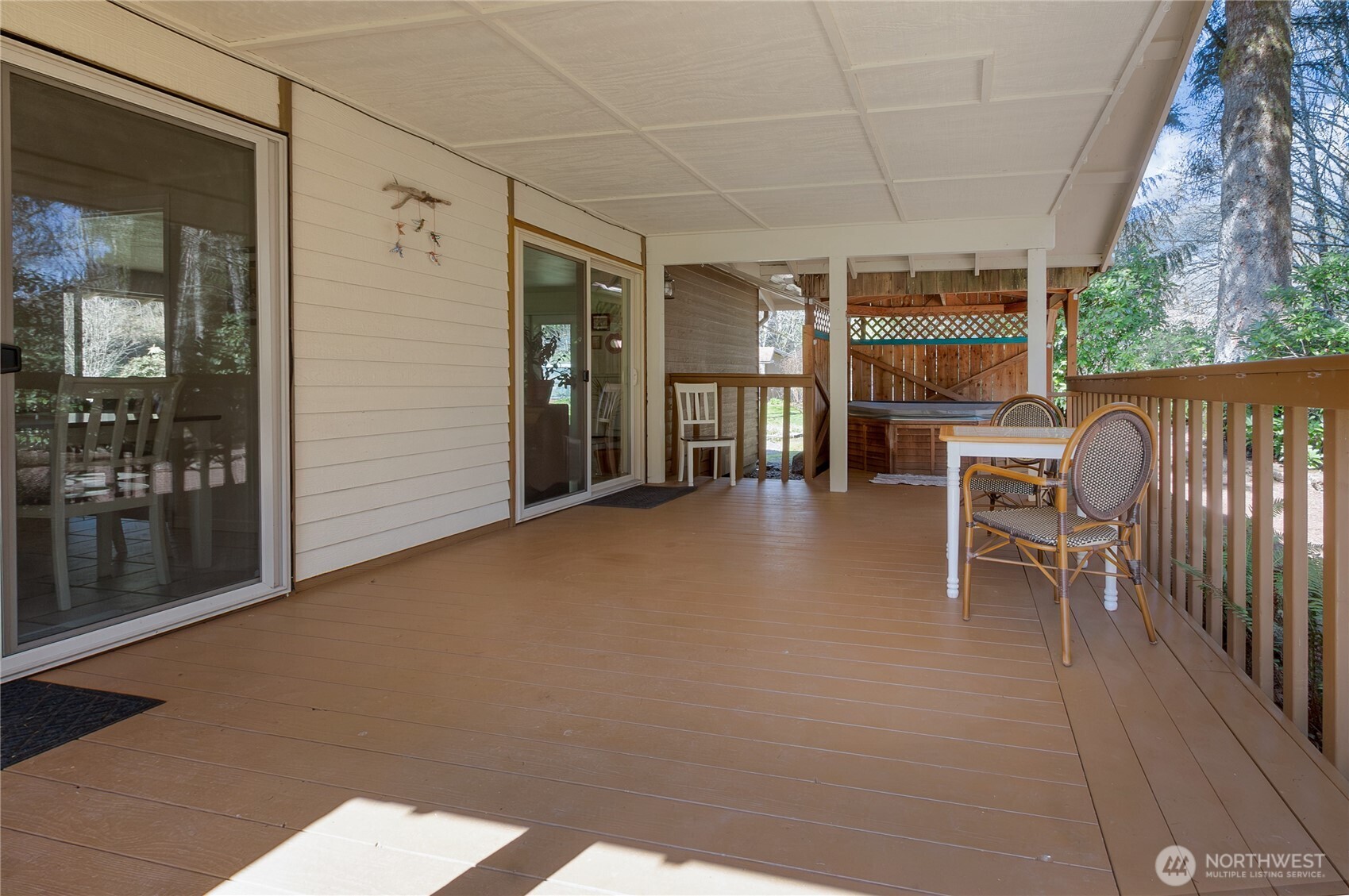 102-40 Crumb Road Morton, WA 98356 - Photo 18 of 40 a view of a patio with a table and chairs next to a yard