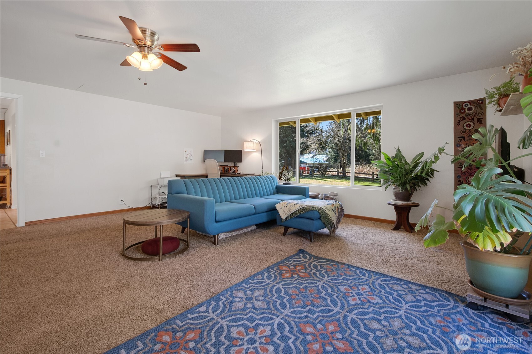 102-40 Crumb Road Morton, WA 98356 - Photo 23 of 40 a living room with furniture fireplace and a potted plant