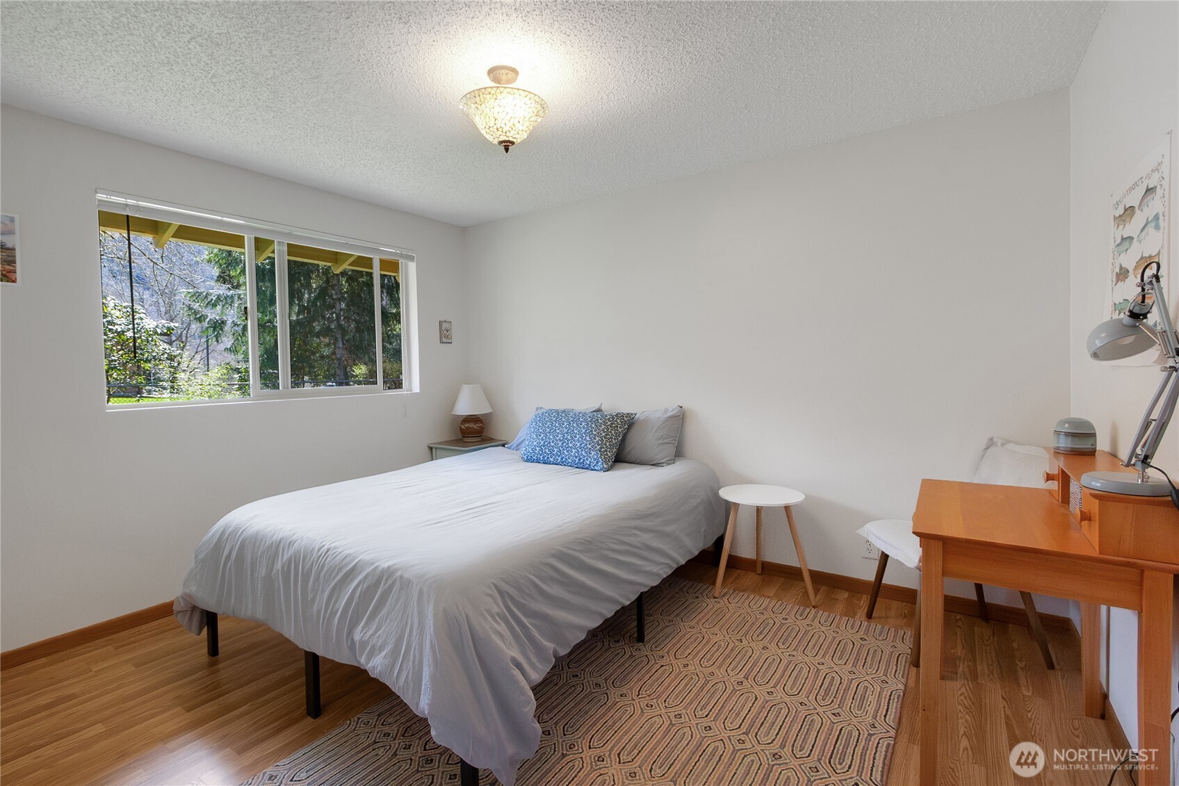 102-40 Crumb Road Morton, WA 98356 - Photo 29 of 40 a bedroom with a bed table and a window
