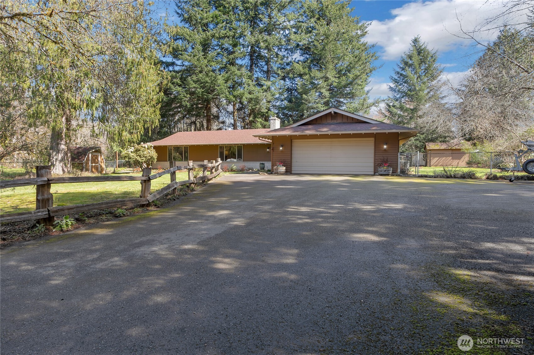 102-40 Crumb Road Morton, WA 98356 - Photo 6 of 40 a view of a house with a yard and garage