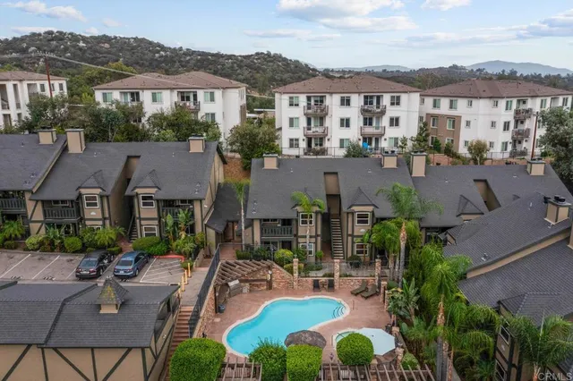 a view of multiple houses with a yard