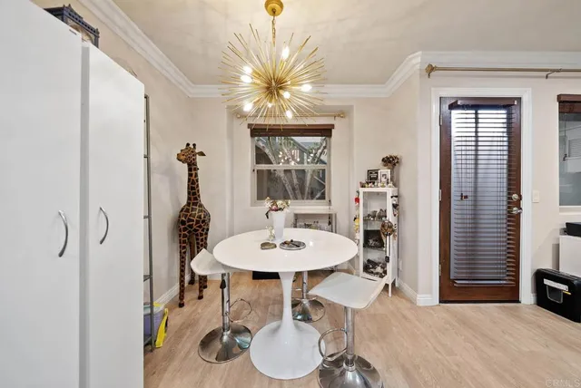 a dining room with furniture and window
