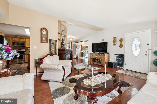 a living room with furniture and a fireplace