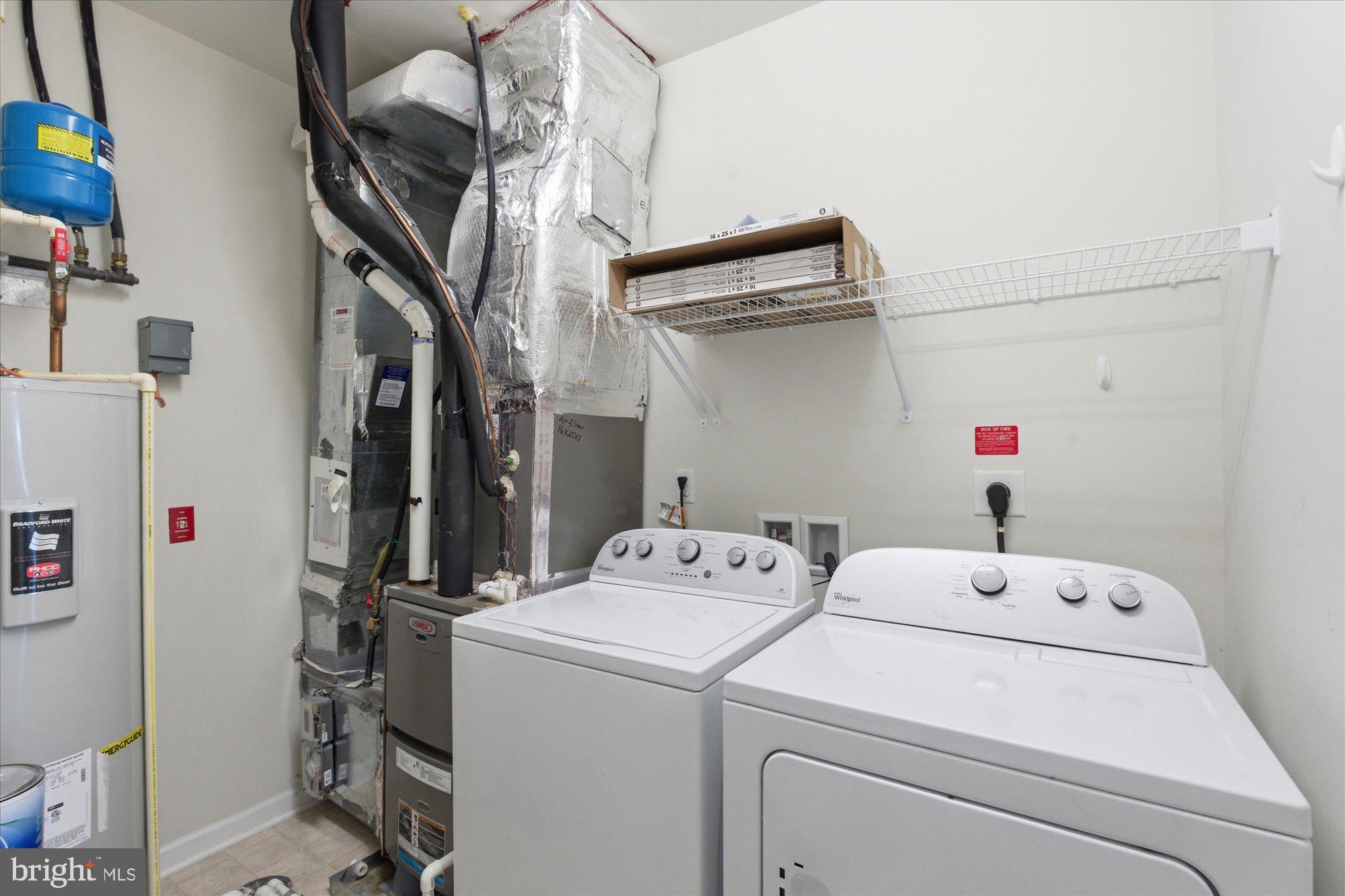 20650 Hope Spring Terrace, Unit 301 Ashburn, VA 20147 - Photo 31 of 35 Washer and dryer