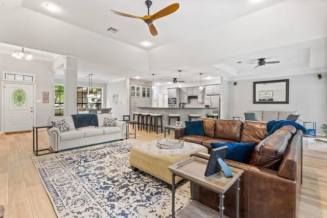 a living room with furniture and a rug