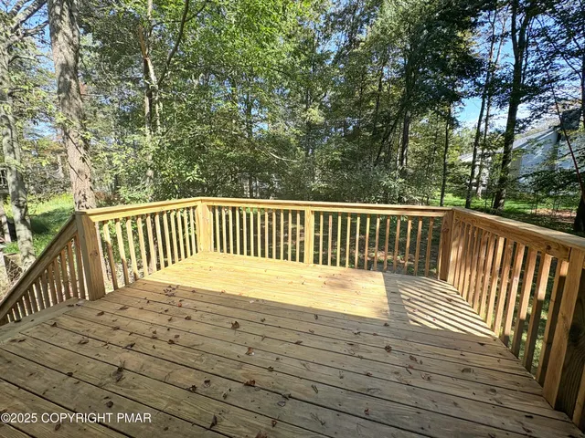 a view of balcony with wooden floor