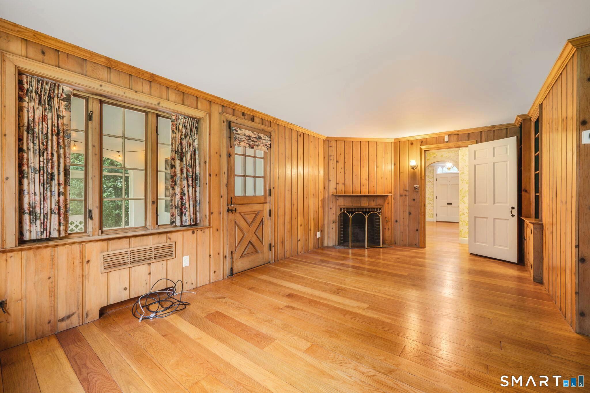 33 Coit Lane Norwich, CT 06360 - Photo 16 of 40 Cozy, fireplaced den area with access to screened sun porch