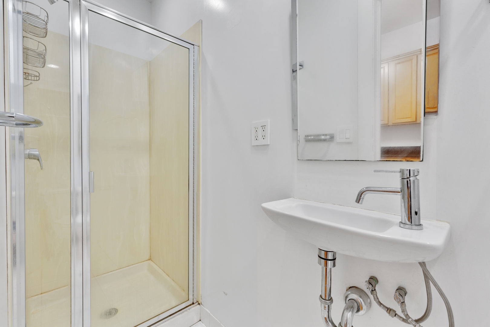 2113 West Concord Place Chicago, IL 60647 - Photo 14 of 20 a bathroom with a sink and a mirror