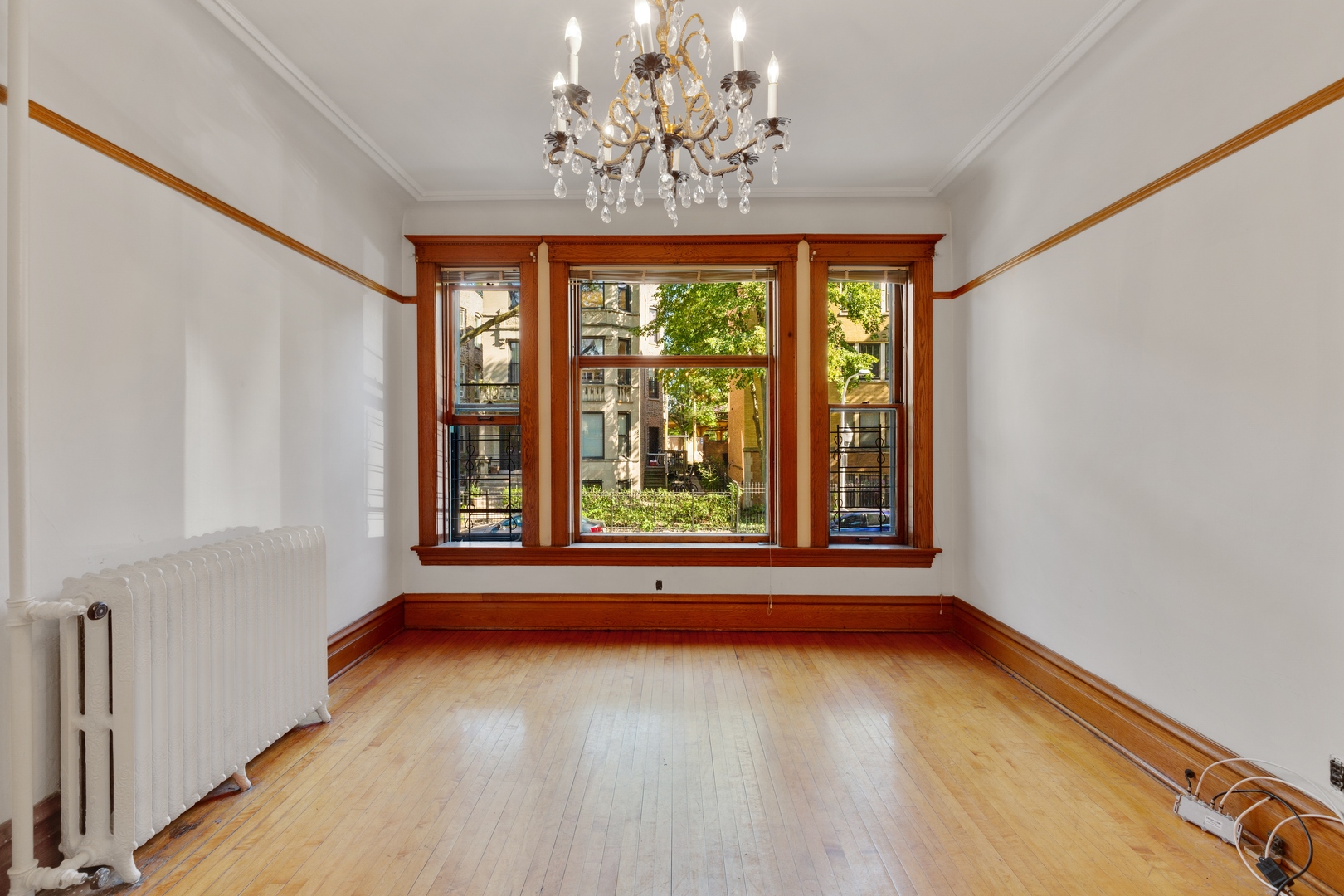 2113 West Concord Place Chicago, IL 60647 - Photo 4 of 20 a view of room with window and chandelier