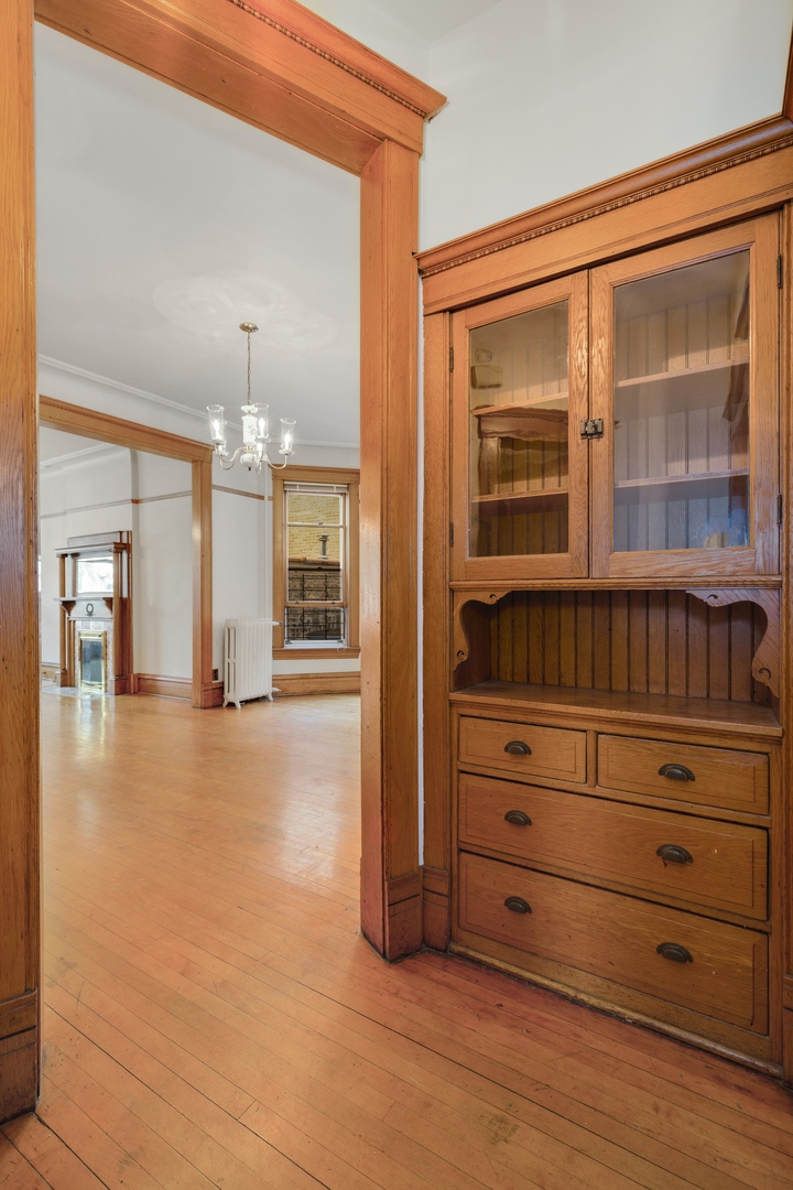 2113 West Concord Place Chicago, IL 60647 - Photo 10 of 20 wooden floor in an empty room with a window