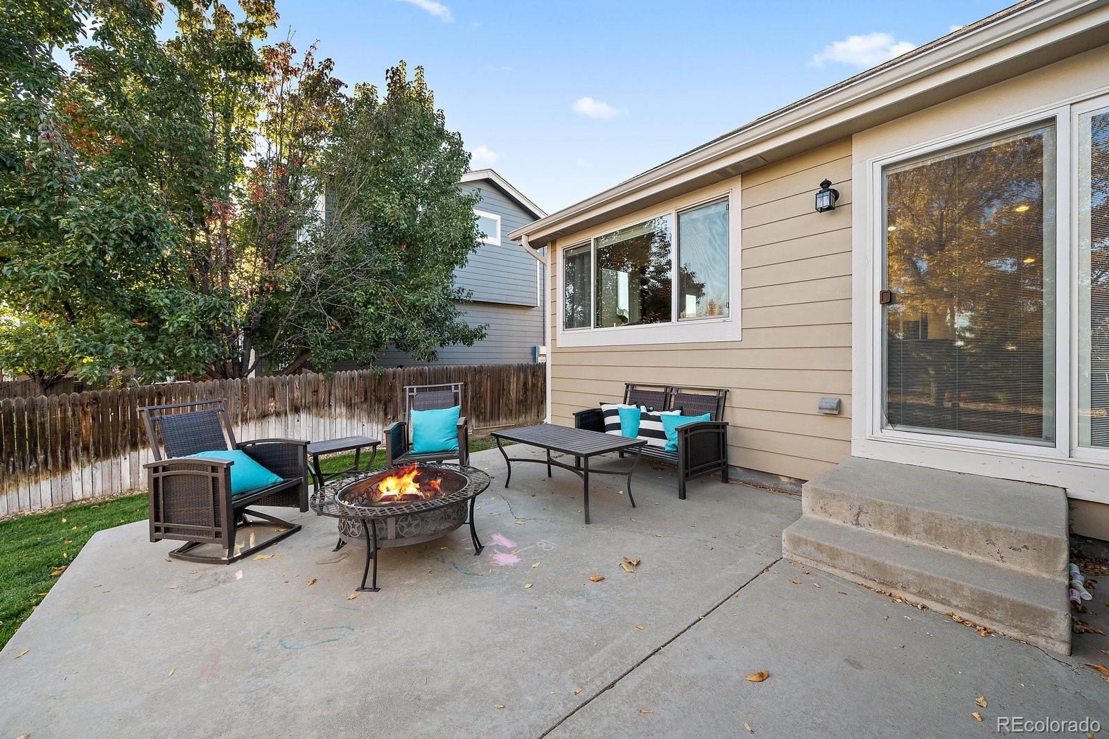 11312 Jersey Drive Thornton, CO 80233 - Photo 16 of 19 a view of a patio with a table and chairs