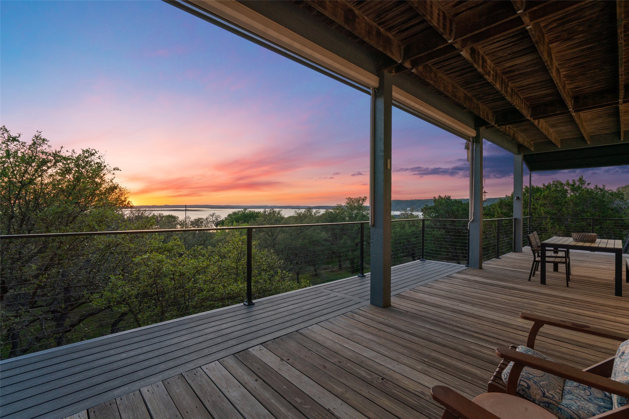 4401 Sunset Cliff Road Burnet, TX 78611 - Photo 10 of 40 Expansive wraparound deck on the main floor offering stunning water views.