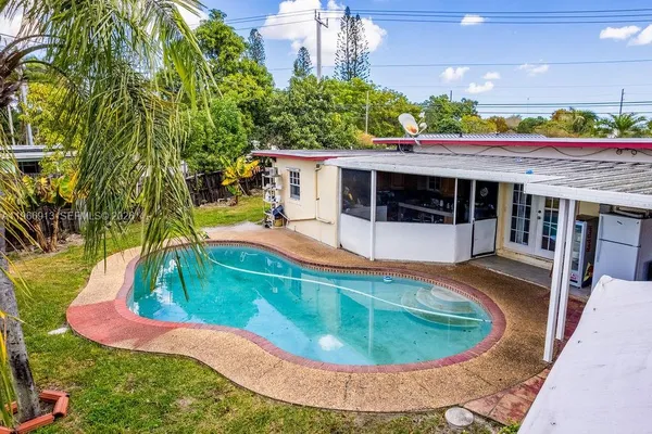 an aerial view of a house with a ocean view