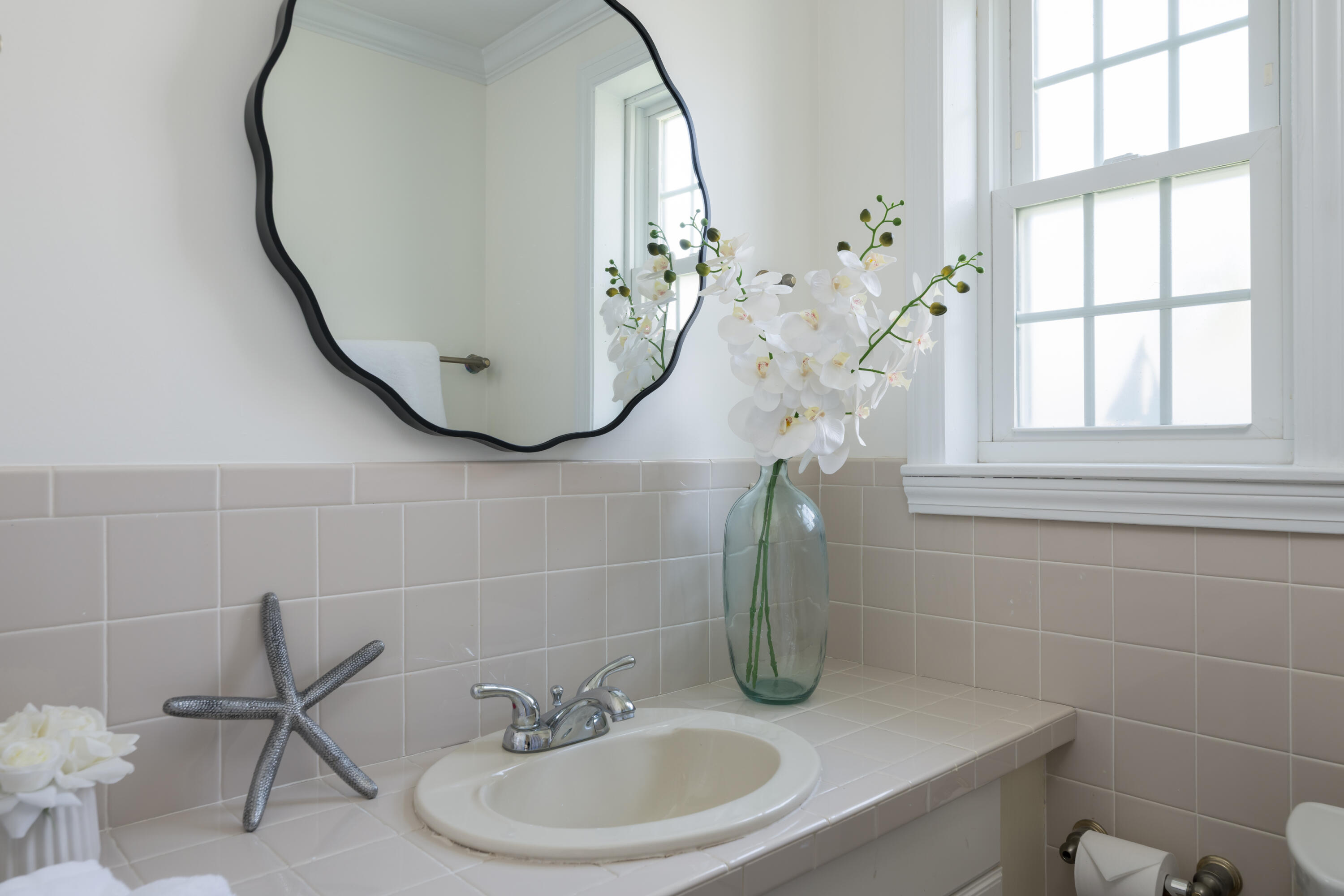 111 Lewis Road West Yarmouth, MA 02673 - Photo 23 of 43 a bathroom with a sink and a mirror