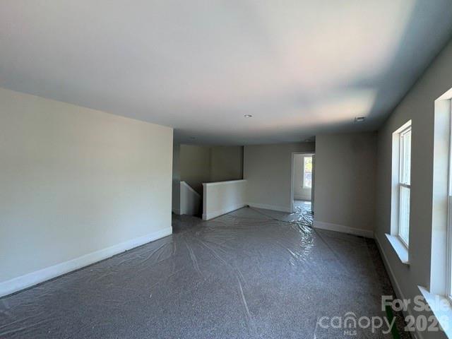 250 Ashley Acres Road Statesville, NC 28677 - Photo 16 of 21 wooden floor in an empty room with a window