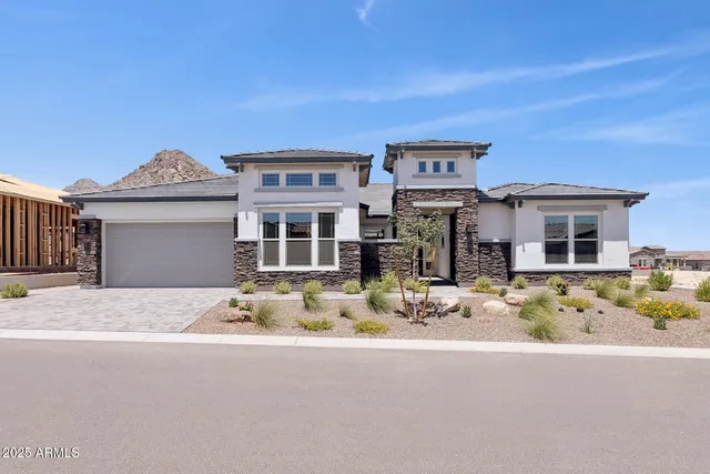 a front view of a house with yellow lighting on it
