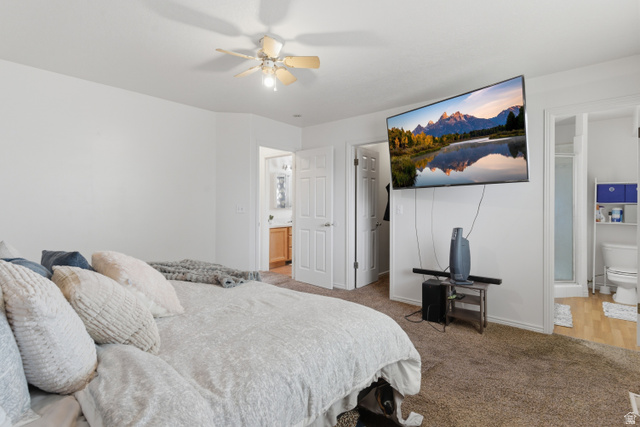 134 West 475 South Ogden, UT 84404 - Photo 12 of 27 Bedroom featuring ensuite bathroom, light carpet, and ceiling fan