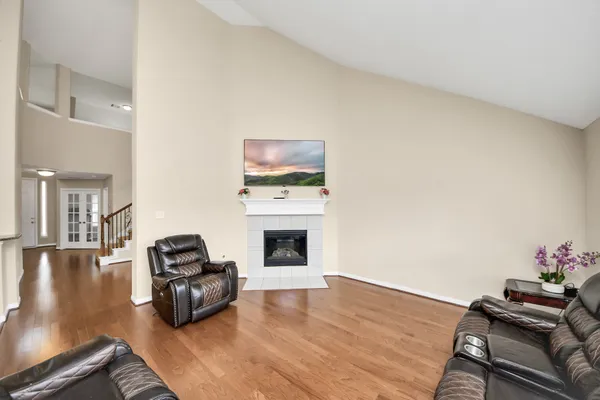 a living room with furniture fireplace and flat screen tv