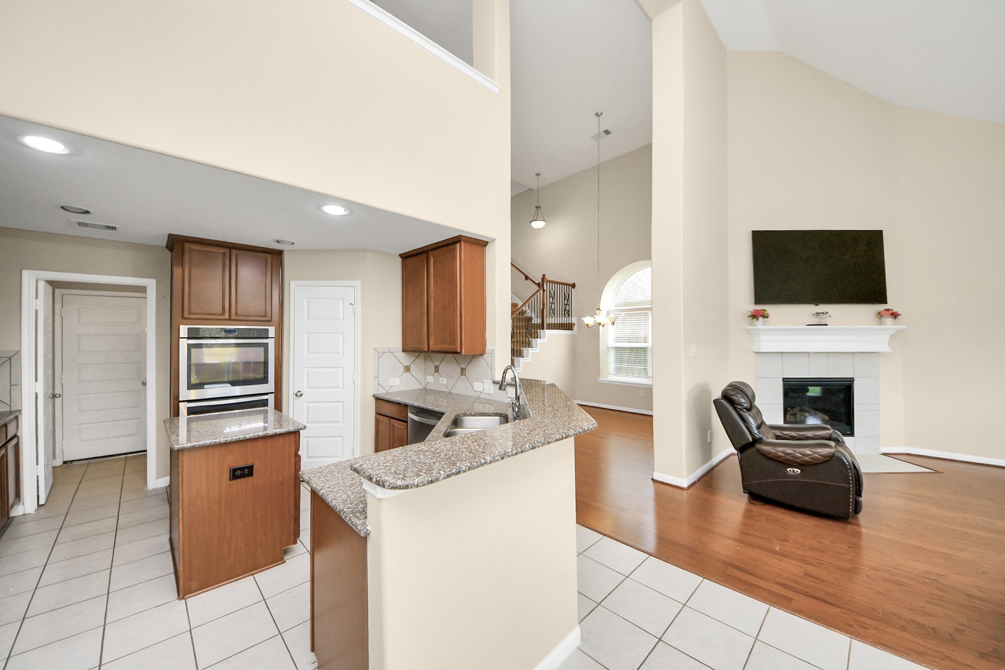 15210 Paxton Landing Lane Cypress, TX 77433 - Photo 20 of 50 a kitchen with a refrigerator and a stove top oven