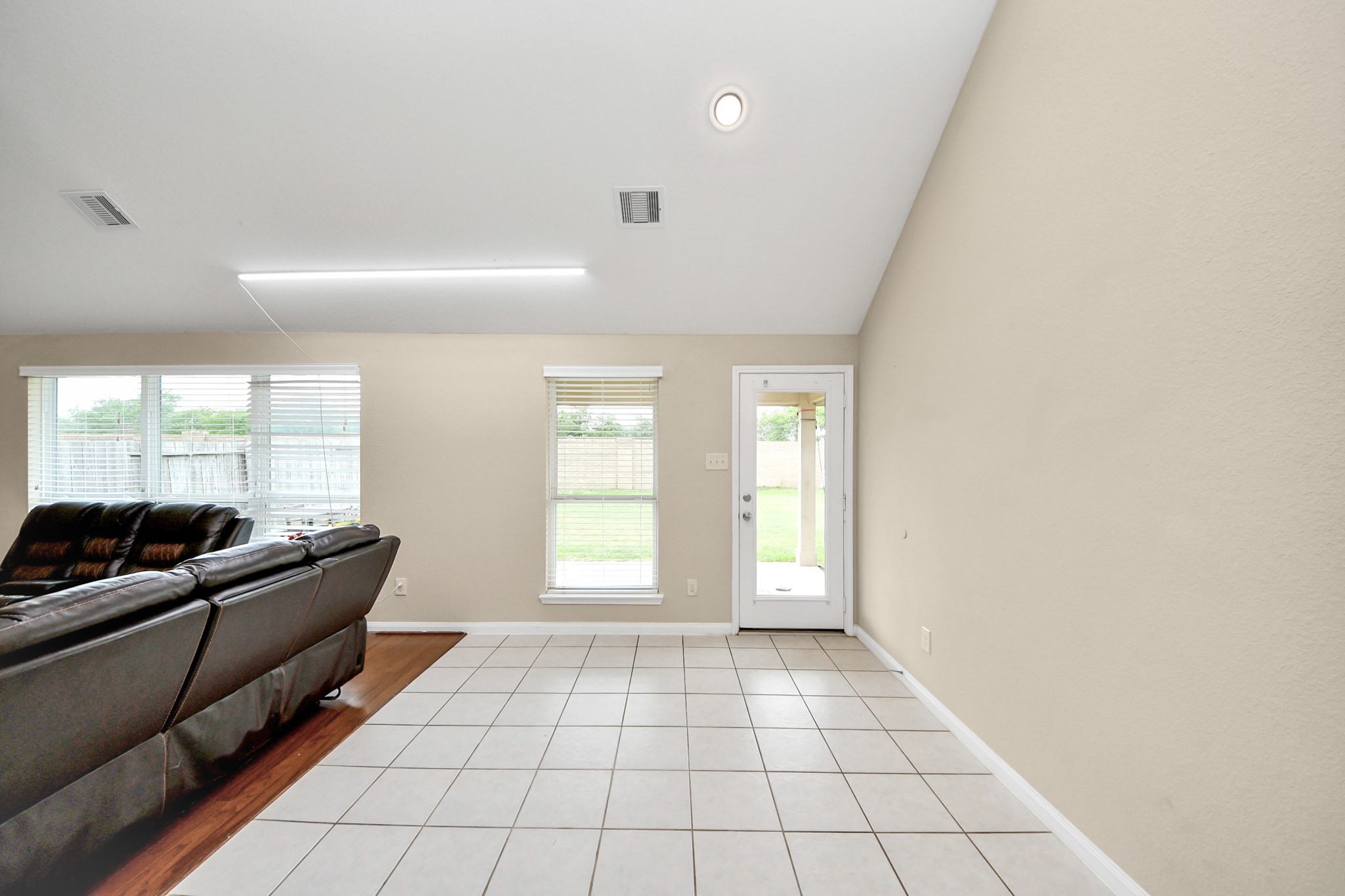15210 Paxton Landing Lane Cypress, TX 77433 - Photo 27 of 50 a living room with furniture and a floor to ceiling window