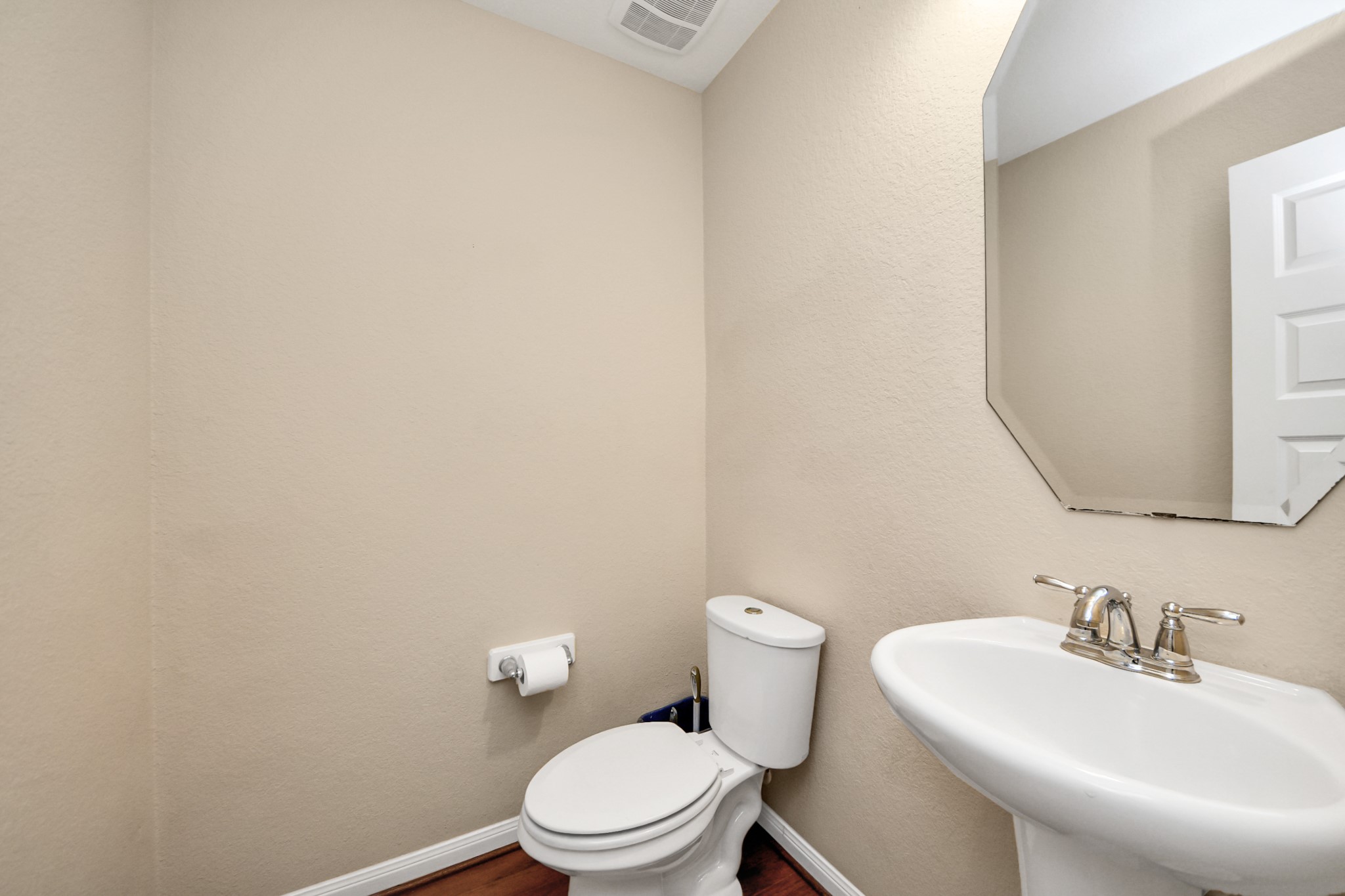 15210 Paxton Landing Lane Cypress, TX 77433 - Photo 29 of 50 a white toilet sitting next to a bathroom sink