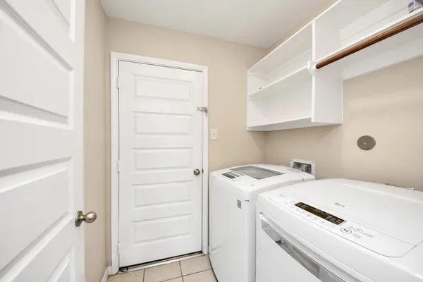 a view of bathroom with washer and dryer