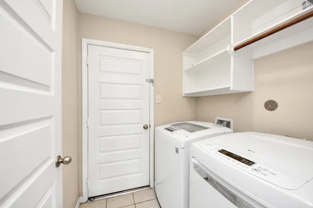 a view of bathroom with washer and dryer
