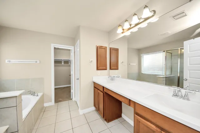 a bathroom with a sink a vanity and a mirror