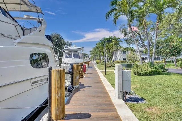 a view of a livingroom with wooden floor and chandelier