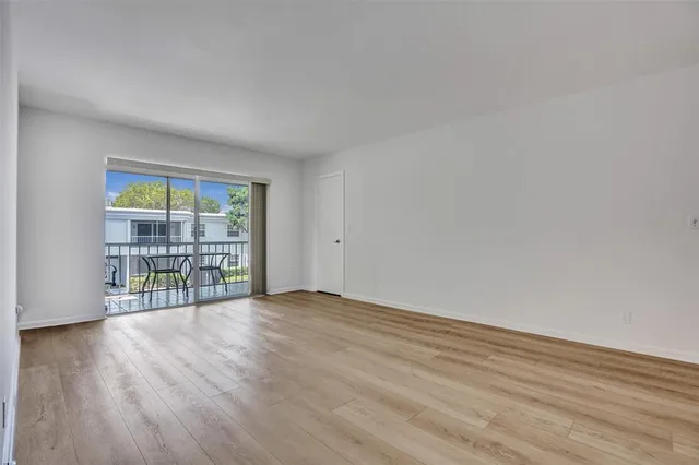 a view of a dining area kitchen with furniture and a potted plant