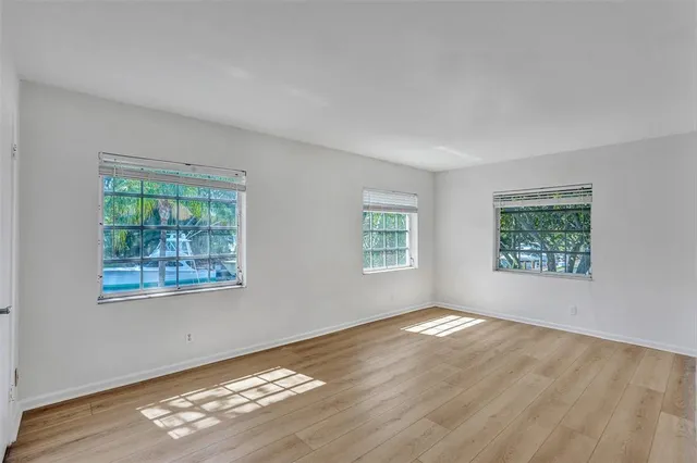 a front view of a house with basket ball table and chairs