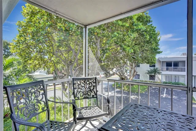 a view of a chair and table in the balcony