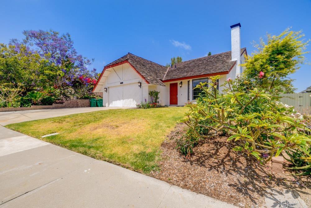 1706 Catalpa Road Carlsbad, CA 92011 - Photo 2 of 30 a view of a house with a yard and potted plants