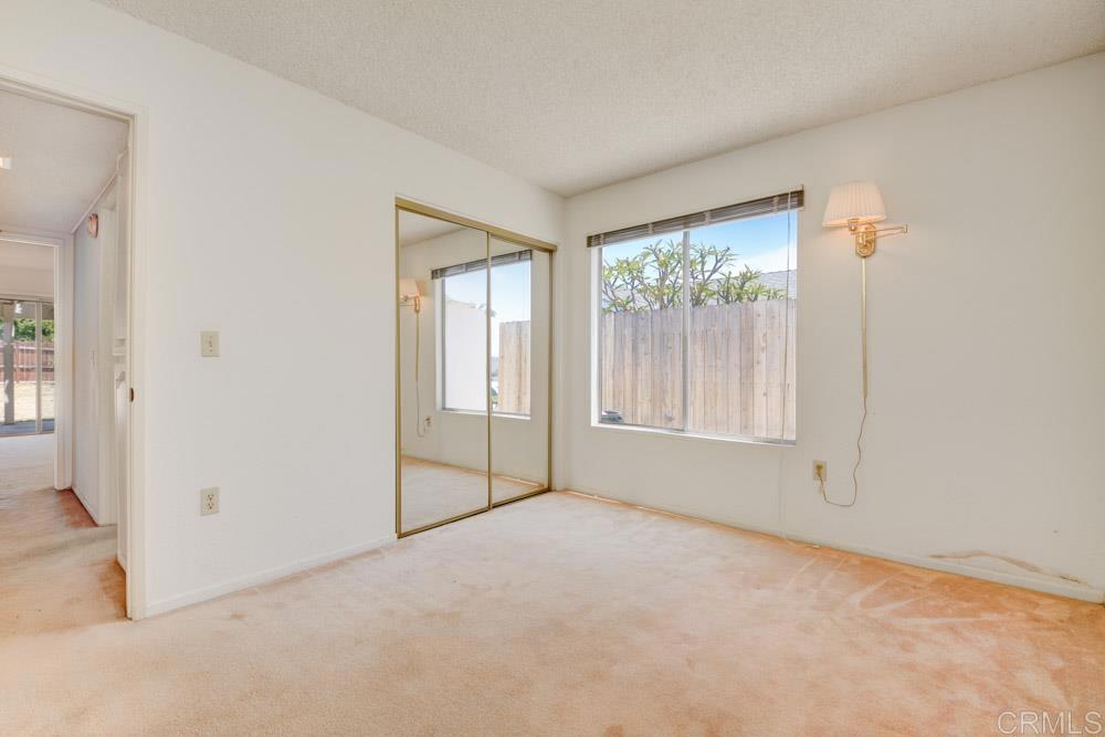 1706 Catalpa Road Carlsbad, CA 92011 - Photo 22 of 30 an empty room with windows